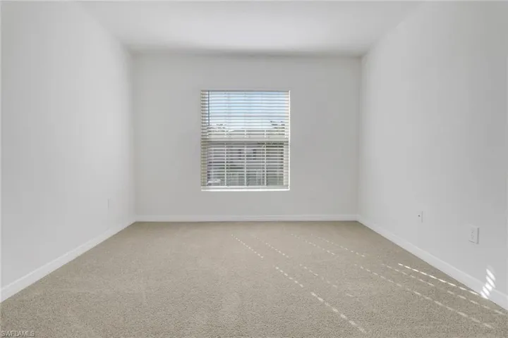 Empty room featuring carpet floors