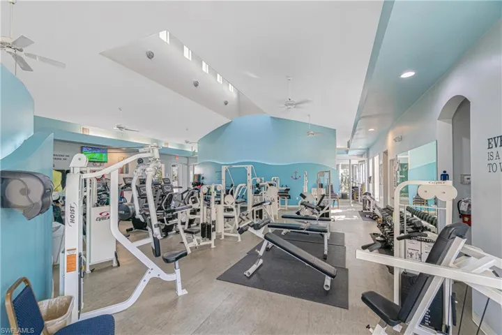 Exercise room featuring ceiling fan and recessed lighting
