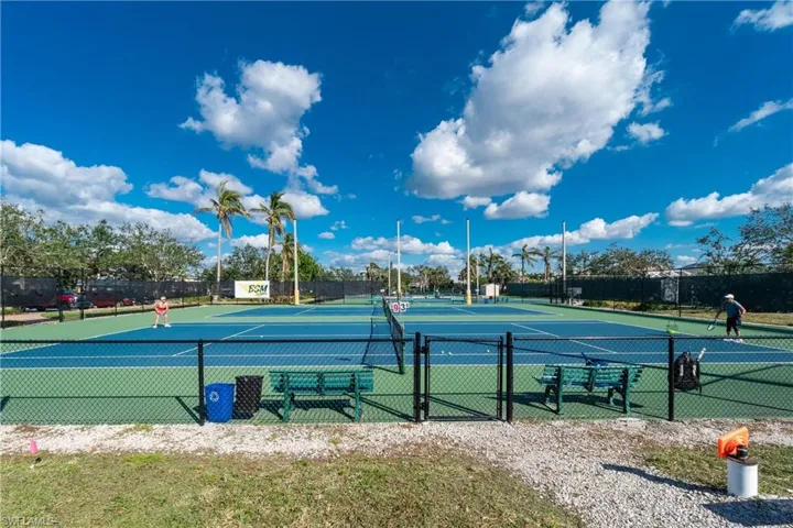 View of tennis court featuring community basketball court