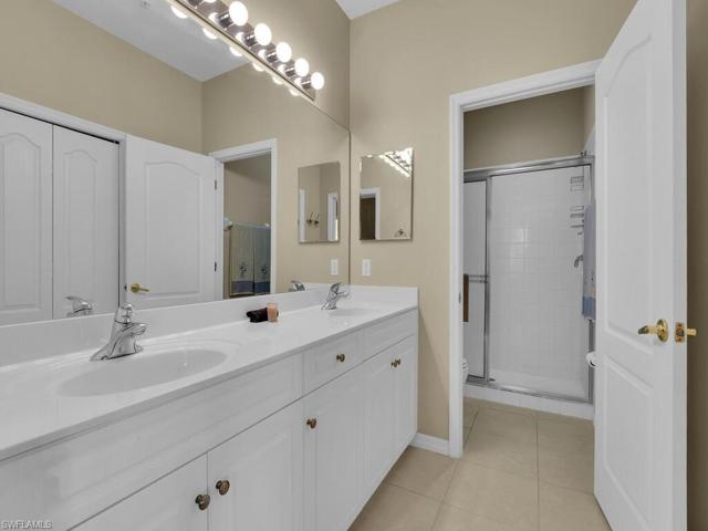 Master bath with dual sinks and large walk-in closet.