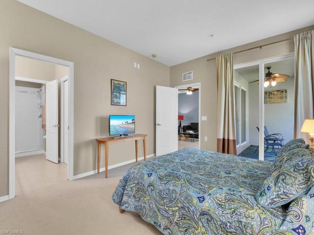 Master bedroom with sliders to balcony, lots of natural light.