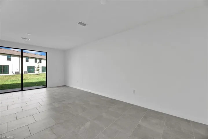 Unfurnished room with baseboards