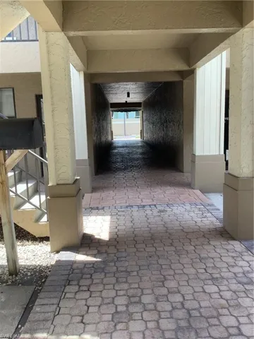 Corridor featuring stairway