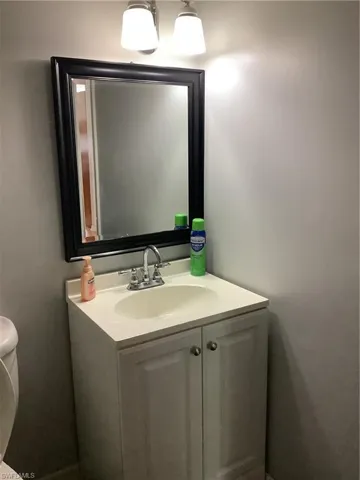 1st Bathroom with vanity and toilet