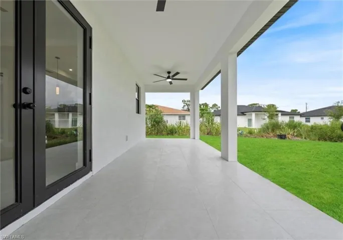 View of patio featuring ceiling fan