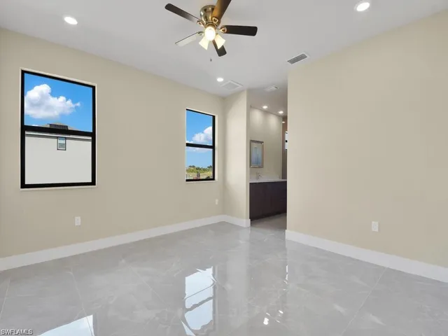 Unfurnished room featuring a ceiling fan and recessed lighting