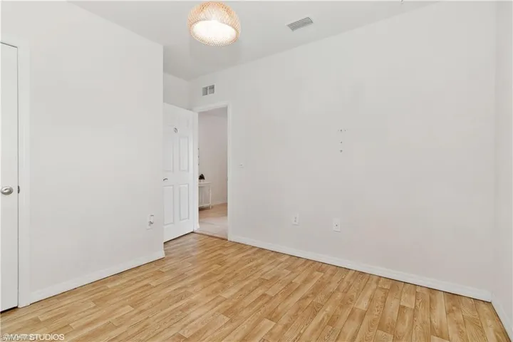 Unfurnished room with light hardwood / wood-style floors