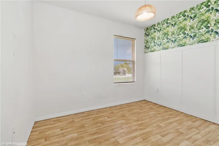 Spare room featuring light hardwood / wood-style flooring