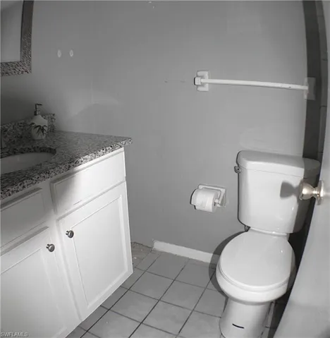 Bathroom featuring light tile patterned floors and vanity