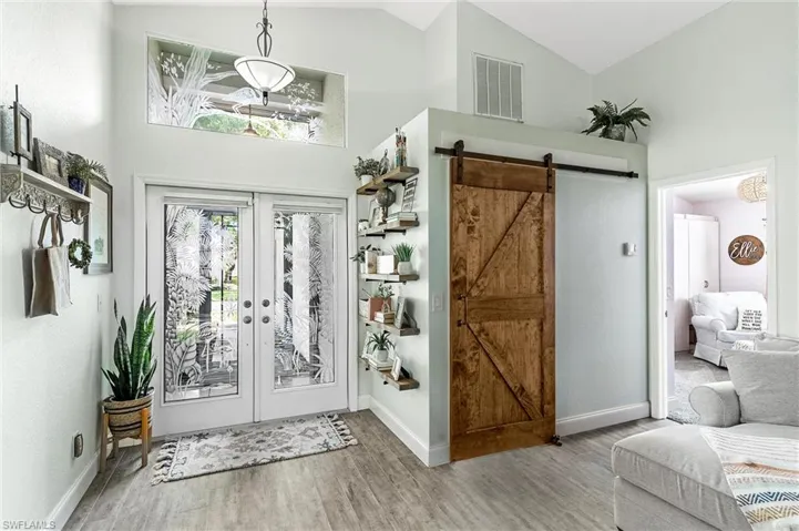 Entry Showing Barn Door to Laundry Room Closed