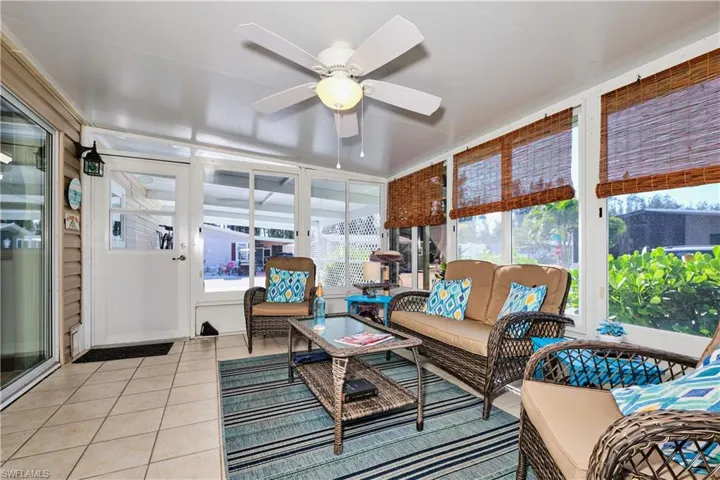 Sunroom / solarium with a ceiling fan