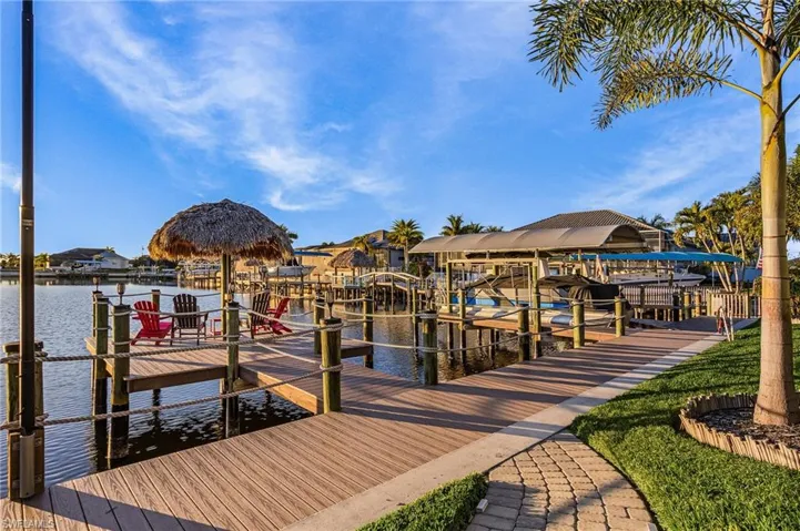 Dock featuring boat lift and a water view