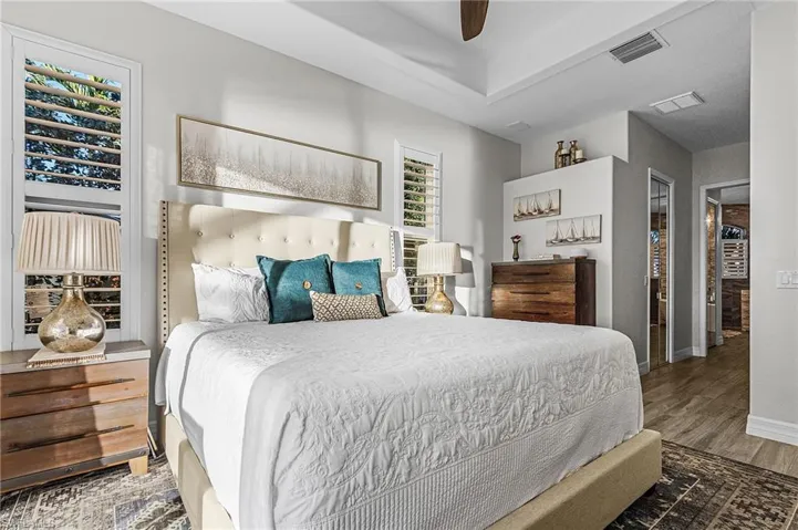 Bedroom featuring ceiling fan and wood finished floors
