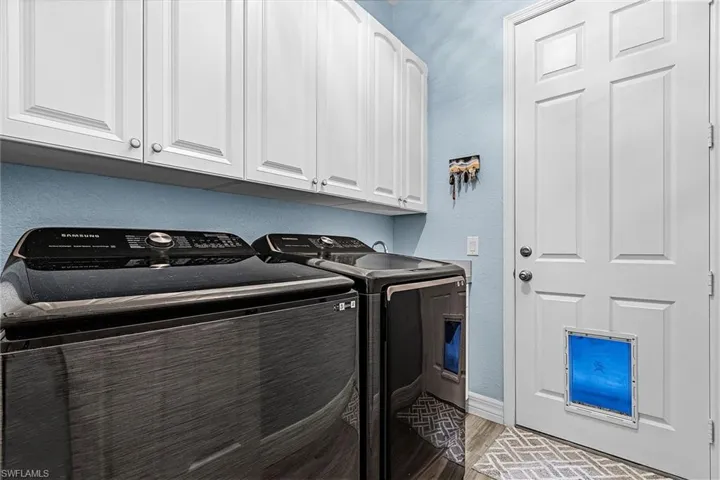 Laundry room featuring cabinet space and washer and dryer