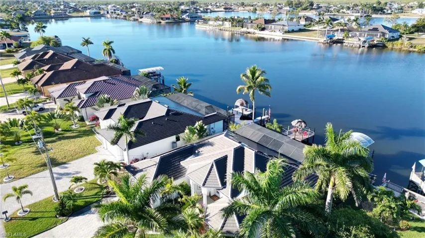 Aerial perspective of suburban area with a nearby body of water