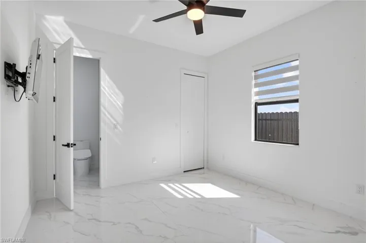 Rear Bedroom 3 with ensuite full bathroom, also serves as a pool bath