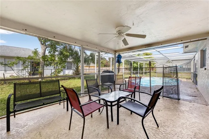 Sunroom / solarium featuring ceiling fan