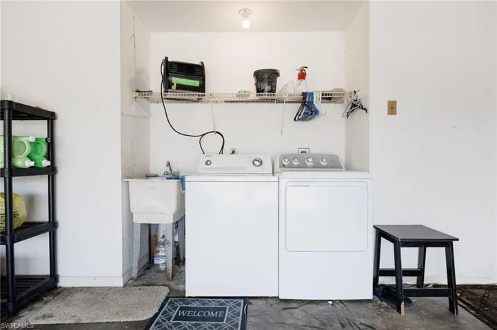 Laundry room with washing machine and dryer