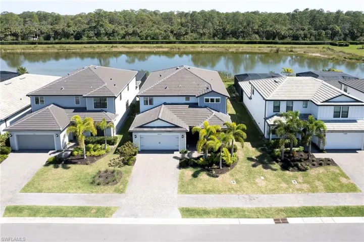 Aerial view featuring a residential view and a water view