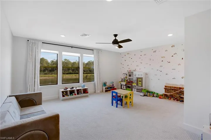 Recreation room featuring optimal lighting, baseboards, visible vents, carpet, and recessed lighting