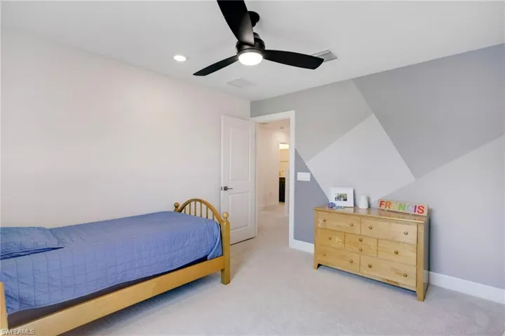 Bedroom featuring recessed lighting, light colored carpet, visible vents, ceiling fan, and baseboards