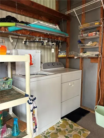 View of Utility/Laundry room off Screened front with separate washer and dryer