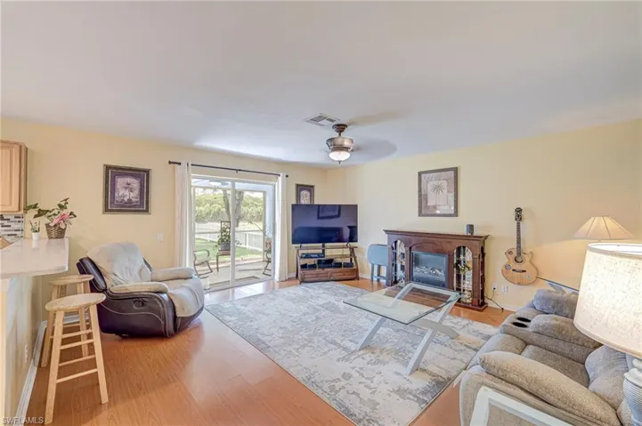 Family room open to the kitchen and large backyard.