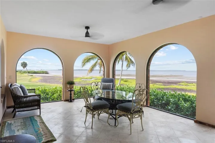 MAIN HOUSE - This property features arched windows that provide extensive views of the water and natural landscape
