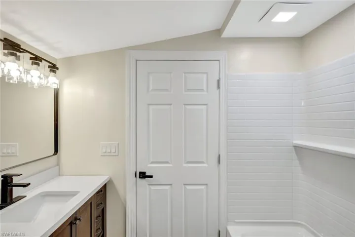 Full bath featuring vanity