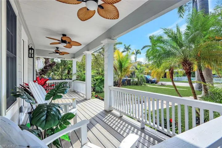 Wooden porch with a lawn