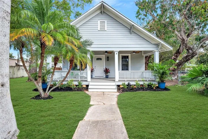 Bungalow-style home featuring a porch and a ceiling fan