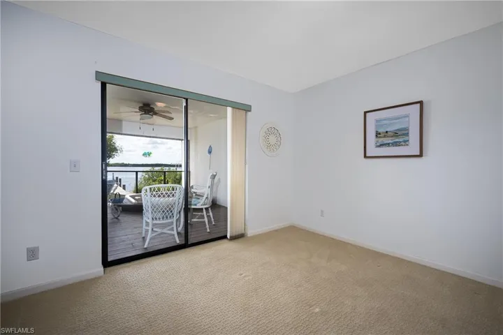 Carpeted spare room with baseboards