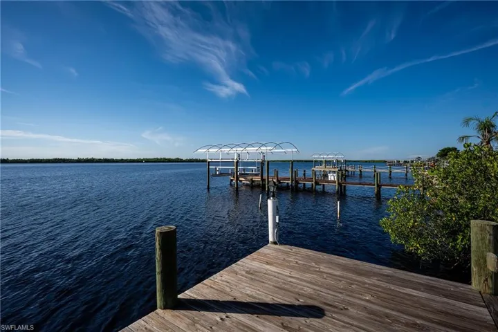 Dock with a water view and boat lift