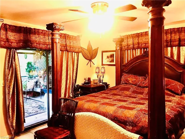 Bedroom featuring access to outside and ceiling fan