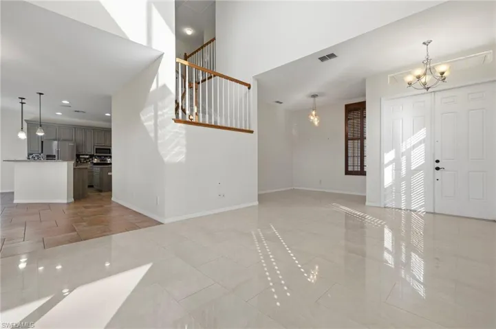 Double door entry with side alcove can be used for study or dining area