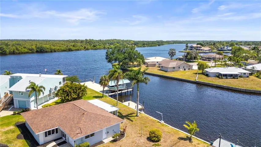 Aerial perspective of suburban area with a large body of water