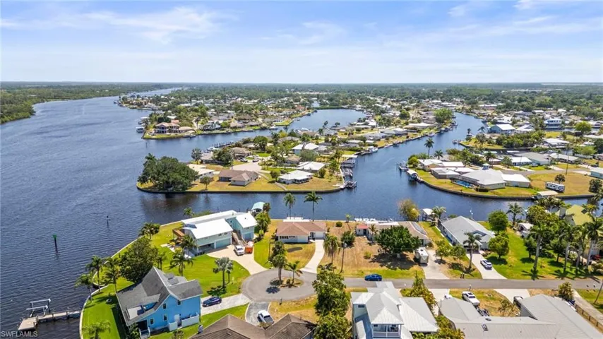Aerial perspective of suburban area with a large body of water