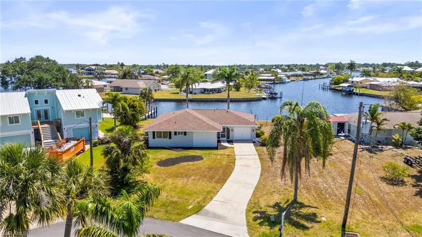 Aerial perspective of suburban area with a nearby body of water