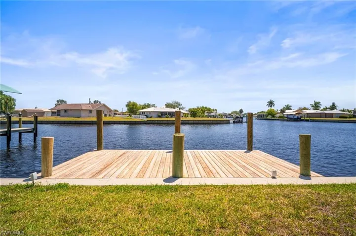 Dock area featuring a water view and a residential view