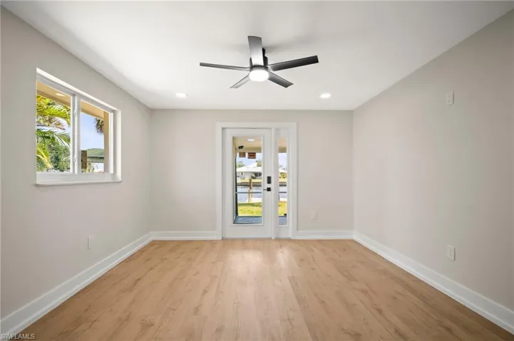 Unfurnished room featuring baseboards, light wood-style flooring, recessed lighting, and a ceiling fan