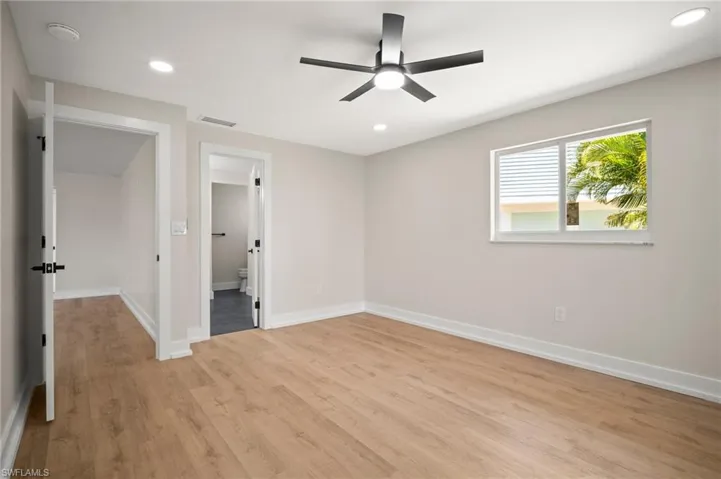 Unfurnished bedroom featuring baseboards, recessed lighting, light wood-style flooring, and visible vents