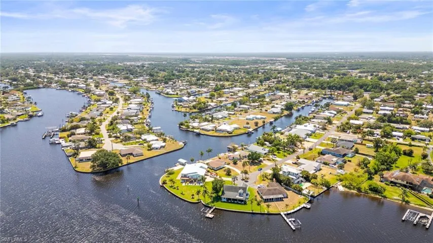 Aerial perspective of suburban area with a large body of water