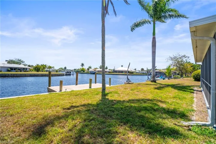 Property view of water with a dock