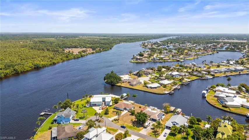 Aerial view of residential area featuring a large body of water