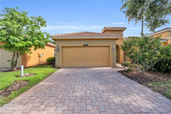 Mediterranean / spanish home with a garage