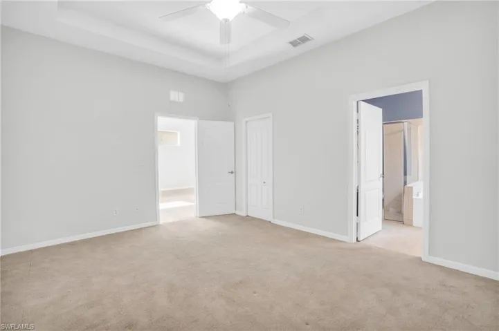 Primary bedroom featuring ensuite bathroom