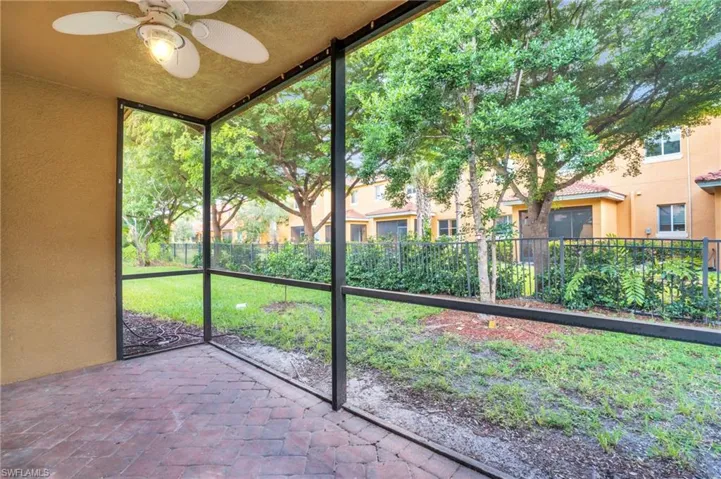 Unfurnished sunroom with ceiling fan