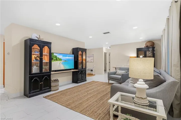 Living room with light tile flooring