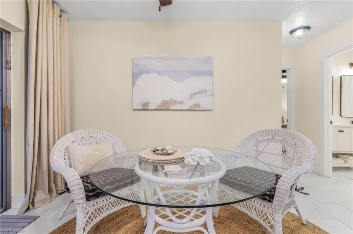 Dining room with light tile flooring