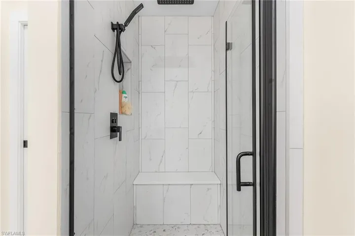 Bathroom featuring a shower with shower door